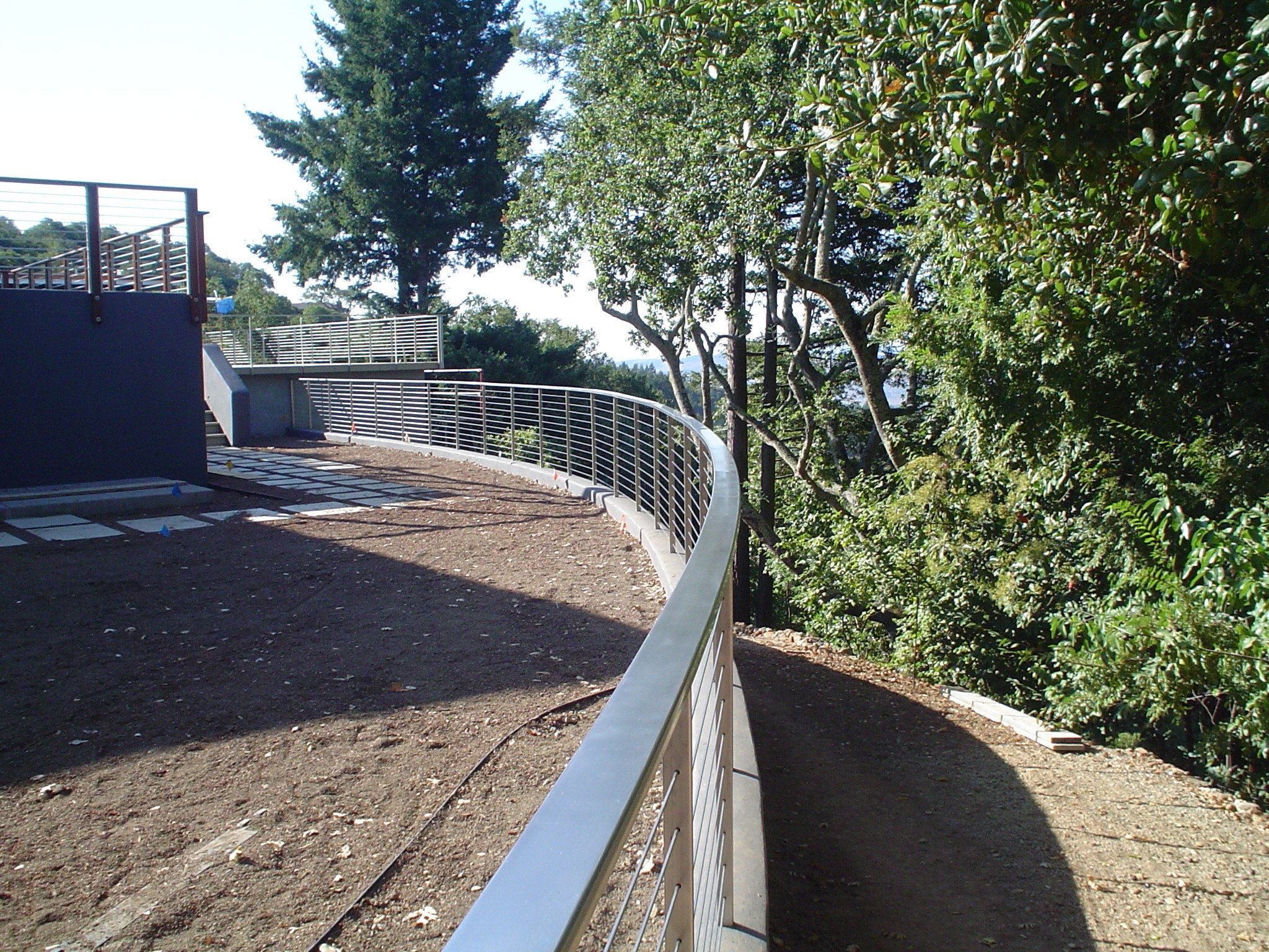 Curved deck rail along edge